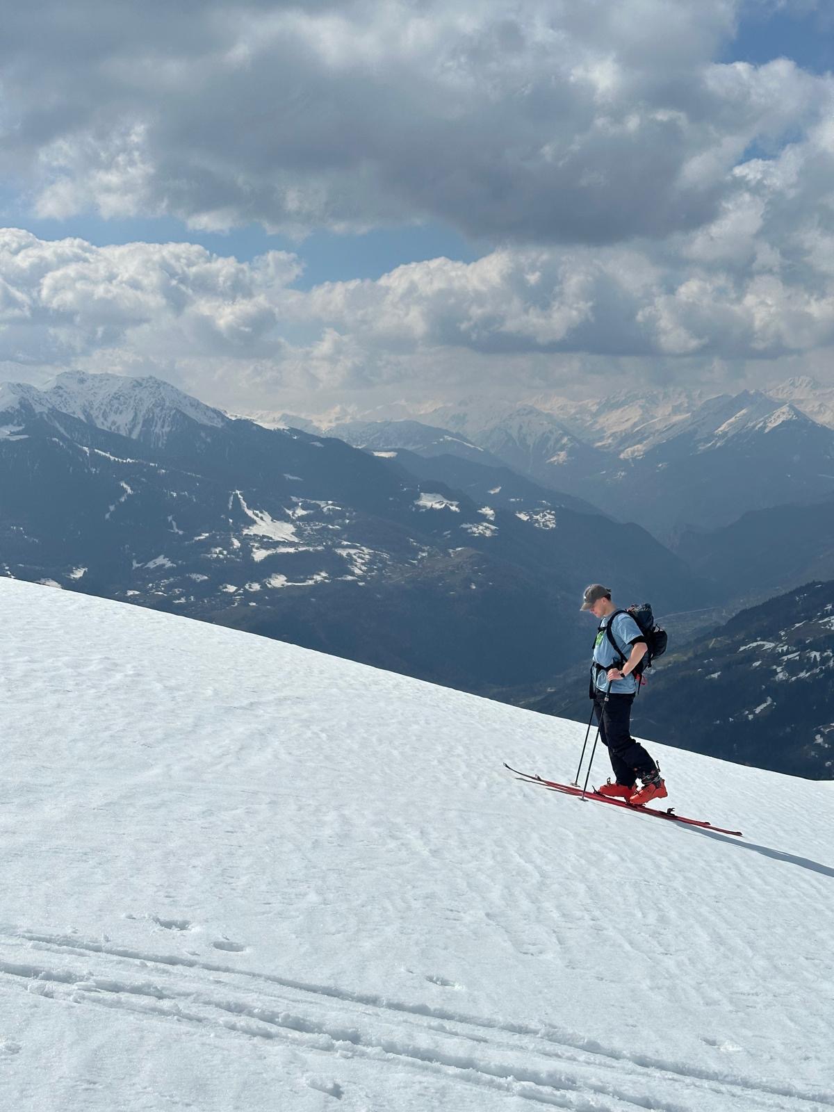 Will climbing across a sunlit mountain landscape